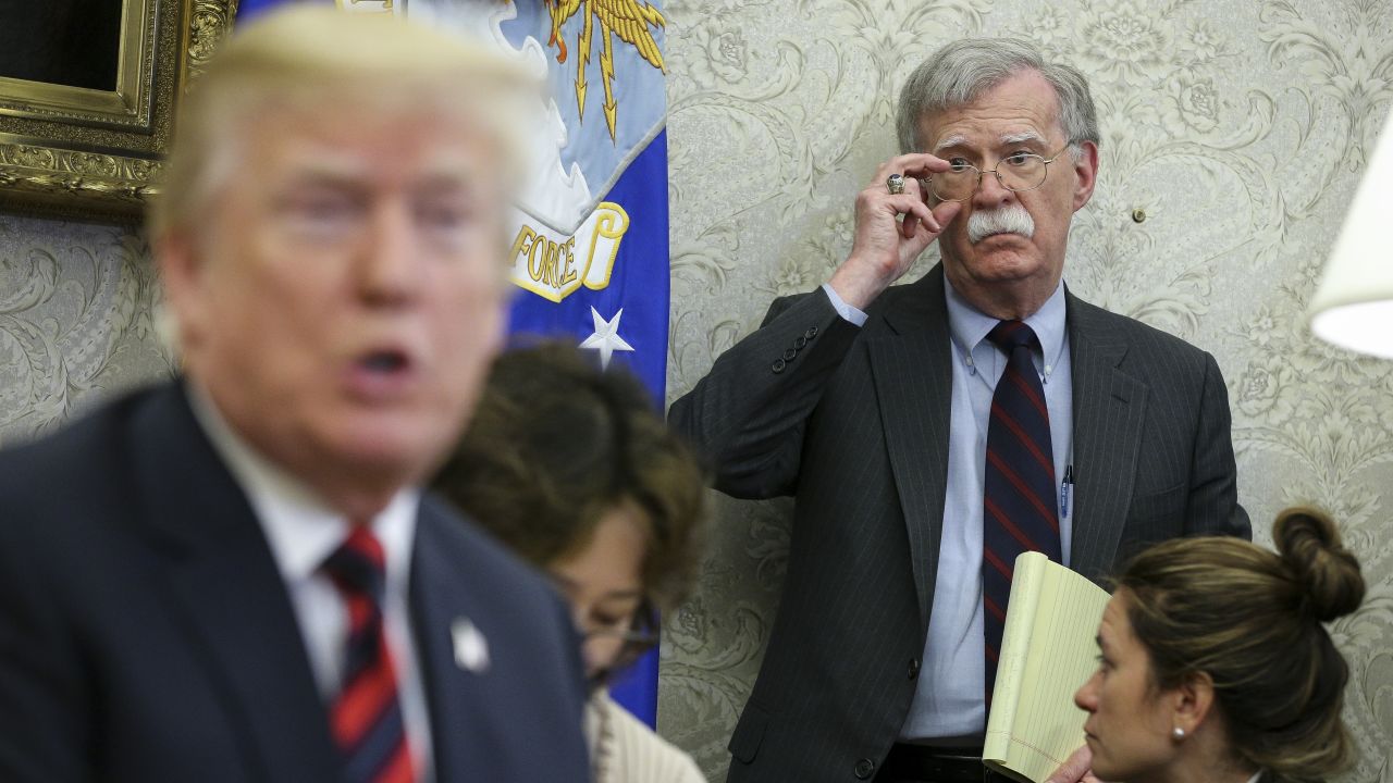 US President Donald Trump speaks as National security advisor John Bolton listens during a meeting with South Korean President Moon Jae-in, in the Oval Office of the White House on May 22, 2018 in Washington DC.  (Oliver Contreras-Pool/Getty Images)