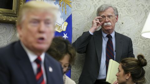 US President Donald Trump speaks as National security advisor John Bolton listens during a meeting in May 2018 in Washington DC. Democrats want to hear from Bolton in their impeachment inquiry but he has thus far refused to show.