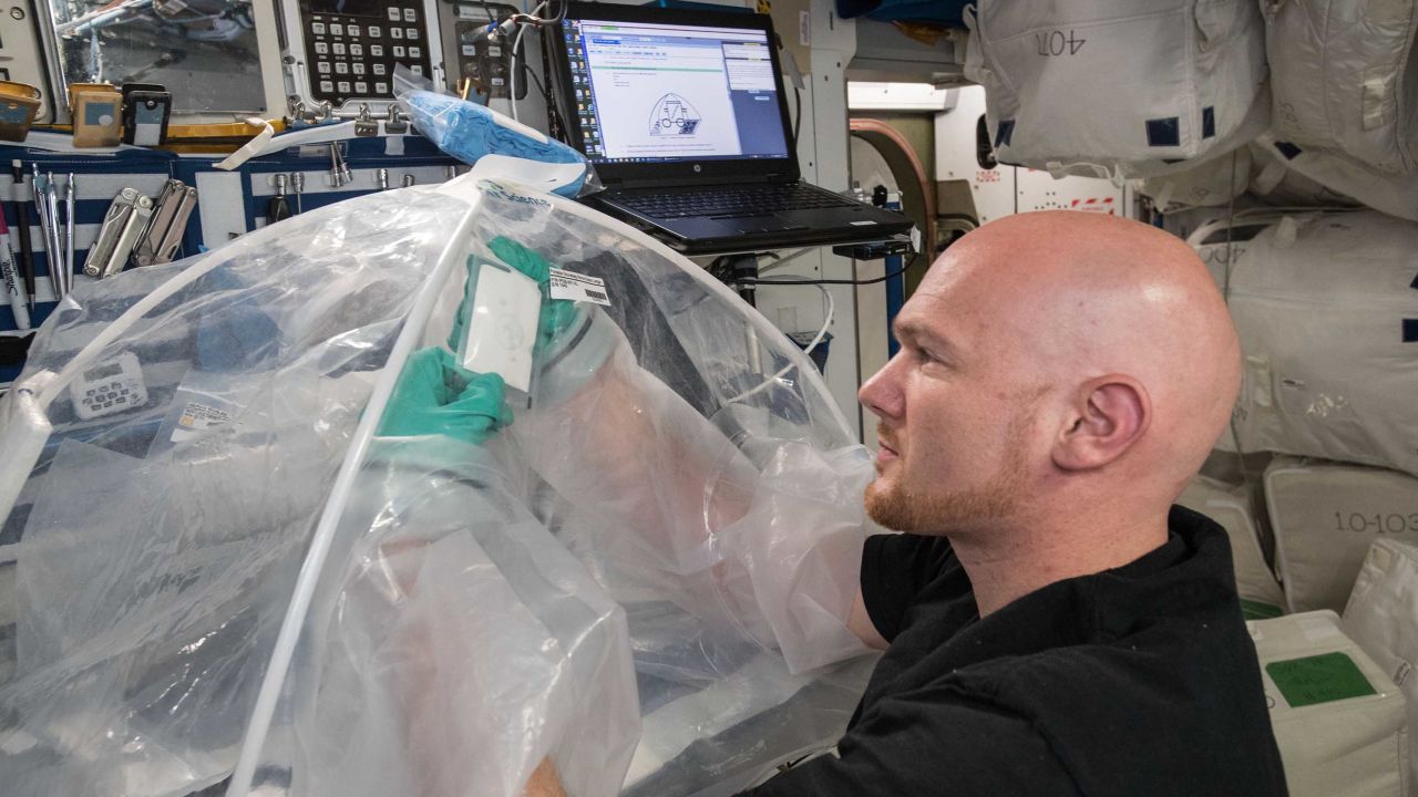 European Space Agency astronaut Alexander Gerst works on the MICS experiment aboard the International Space Station. 