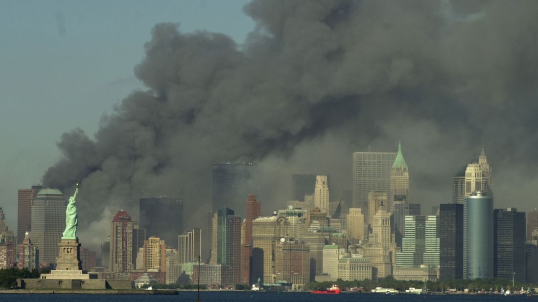 Thick smoke rises over the New York City skyline after the World Trade Center towers were downed by terrorists on September 11, 2001.