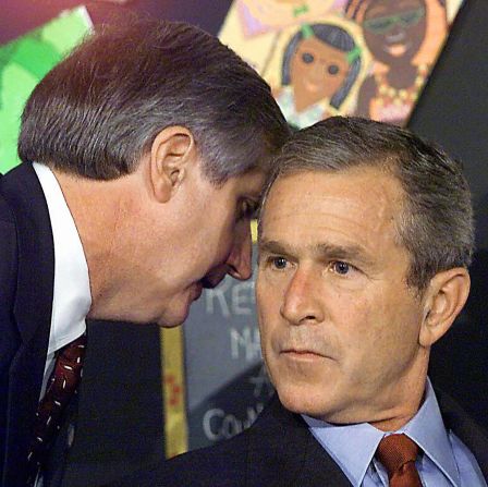 White House Chief of Staff Andrew Card whispers into the ear of US President George W. Bush as Bush was visiting an elementary school in Sarasota, Florida. <a href="index.php?page=&url=http%3A%2F%2Fwww.sfgate.com%2Fnews%2Farticle%2F9-11-Voices-What-If-You-Had-To-Tell-The-2799179.php" target="_blank" target="_blank">"America is under attack," he said.</a>