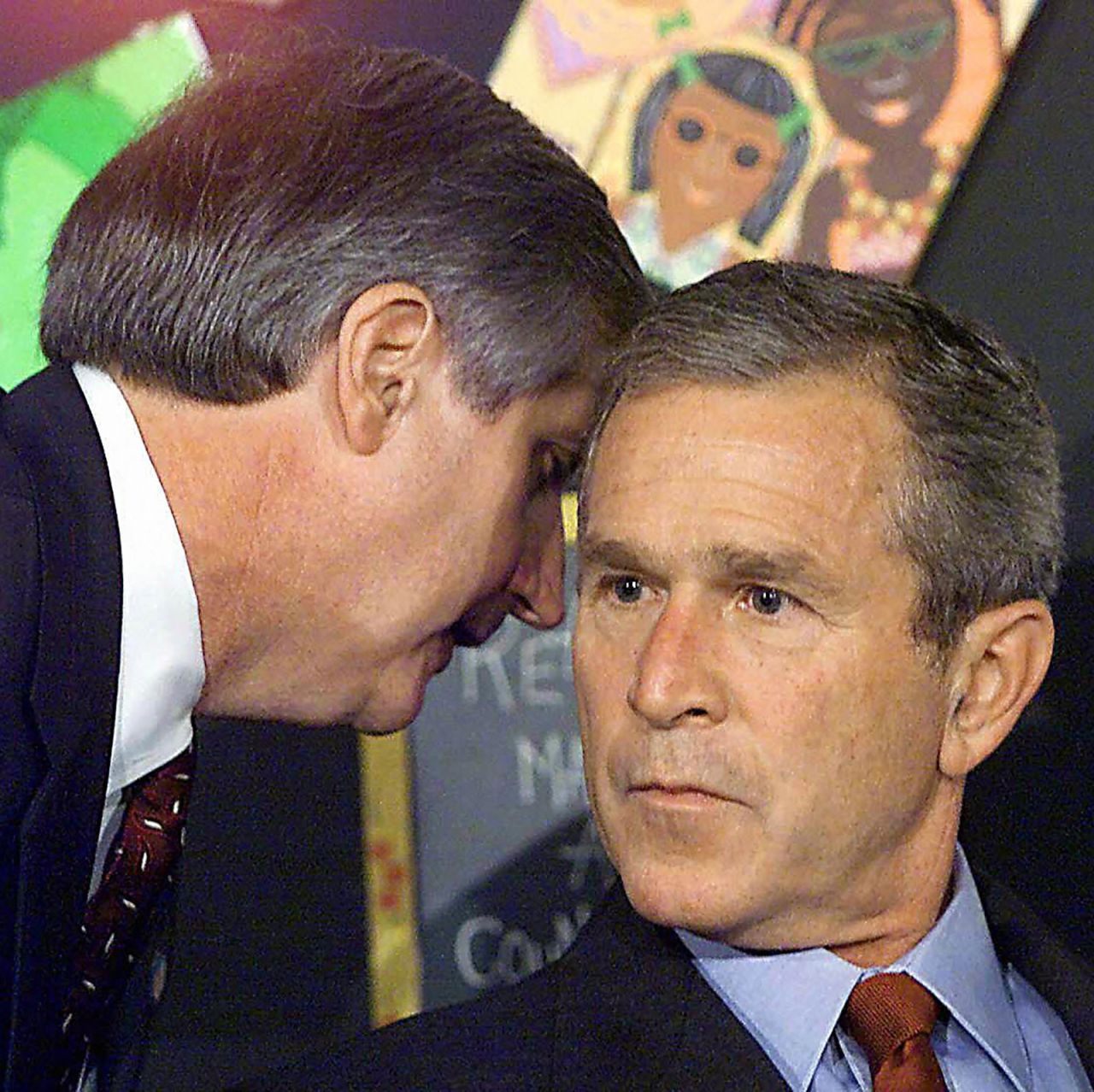 White House Chief of Staff Andrew Card whispers into the ear of US President George W. Bush as Bush was visiting an elementary school in Sarasota, Florida. <a href="http://www.sfgate.com/news/article/9-11-Voices-What-If-You-Had-To-Tell-The-2799179.php" target="_blank" target="_blank">"America is under attack," he said.</a>