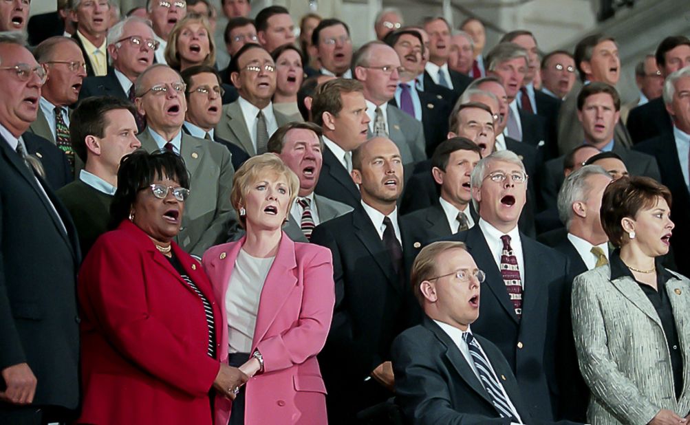 Members of Congress gather on the east steps of Capitol Hill and sing "God Bless America" to denounce the terrorist attacks.