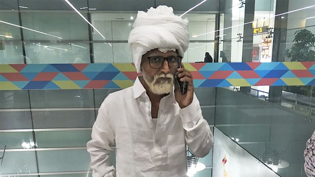 <strong>A cunning disguise:</strong> Jayesh Patel, 32, was caught at New Delhi's Indira Gandhi International Airport trying to board a flight while impersonating a senior citizen. 
