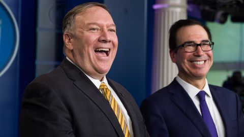 Secretary of State Mike Pompeo and Treasury Secretary Steve Mnuchin laugh as they speak with reporters in the White House briefing room about the ouster of former National Security Adviser John Bolton on Tuesday, September 10, 2019, in Washington. 