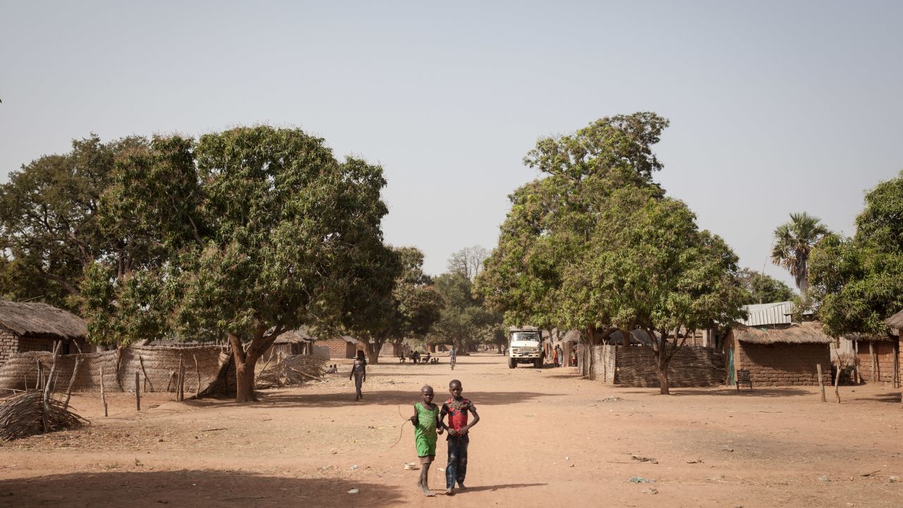 Two young boys walk in the main street of Tiringoulou, northern Central African Republic.