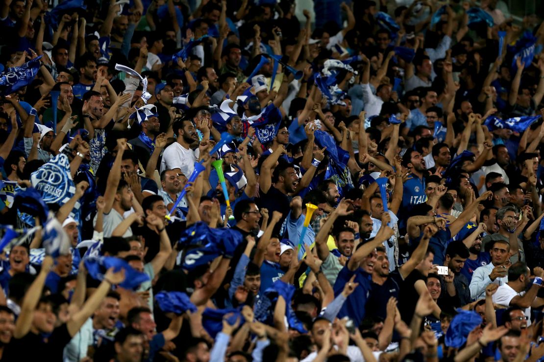 Iranian fans cheer for their team during the AFC Champions League football match Al-Sadd vs Esteghlal FC.