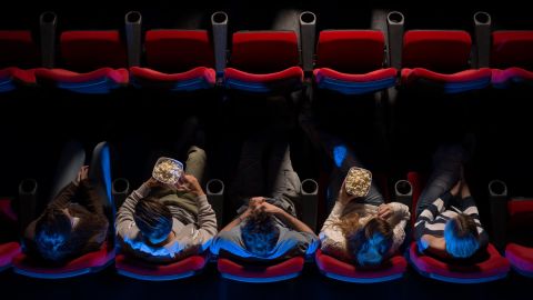 A group of most assuredly platonic friends take in a movie.
