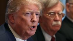 WASHINGTON, DC - APRIL 09: U.S. President Donald Trump is flanked by National Security Advisor John Bolton as he speaks about the FBI raid at his lawyer Michael Cohen's office, while receiving a briefing from senior military leaders regarding Syria,  in the Cabinet Room, on April 9, 2018 in Washington, DC.  The FBI raided the office of Michael Cohen on Monday as part of the ongoing investigation into the president's administration. (Photo by Mark Wilson/Getty Images)