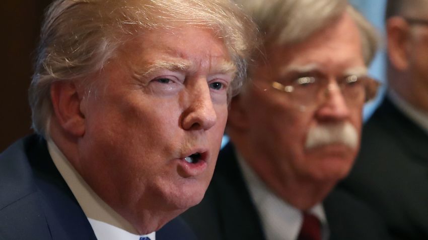 WASHINGTON, DC - APRIL 09: U.S. President Donald Trump is flanked by National Security Advisor John Bolton as he speaks about the FBI raid at his lawyer Michael Cohen's office, while receiving a briefing from senior military leaders regarding Syria, in the Cabinet Room, on April 9, 2018 in Washington, DC. The FBI raided the office of Michael Cohen on Monday as part of the ongoing investigation into the president's administration. (Photo by Mark Wilson/Getty Images)