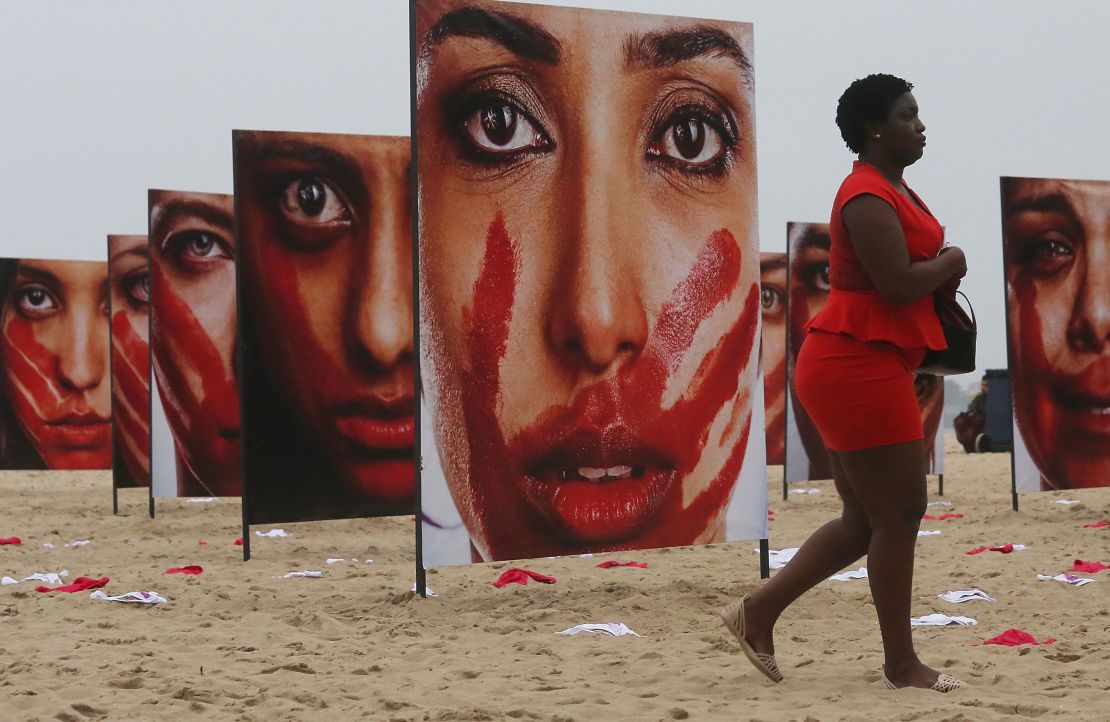 Images of models portraying women who have been abused at a demonstration opposing violence against women on Copacabana beach in 2016.