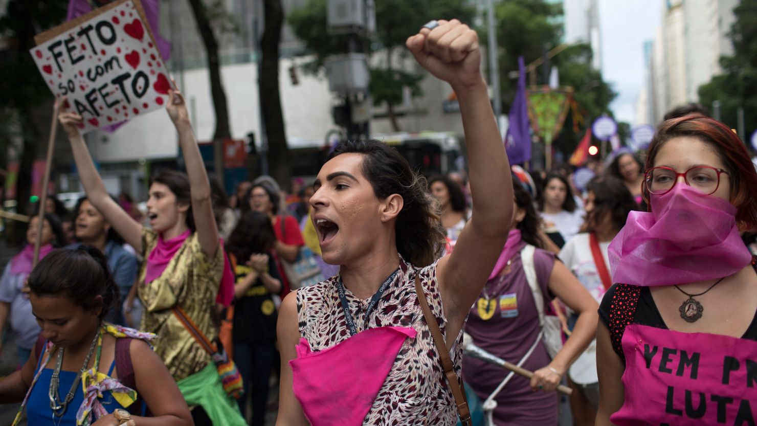 Women wear pink masks protesting violence against women in Rio de Janeiro, Brazil, on November 28, 2017. 