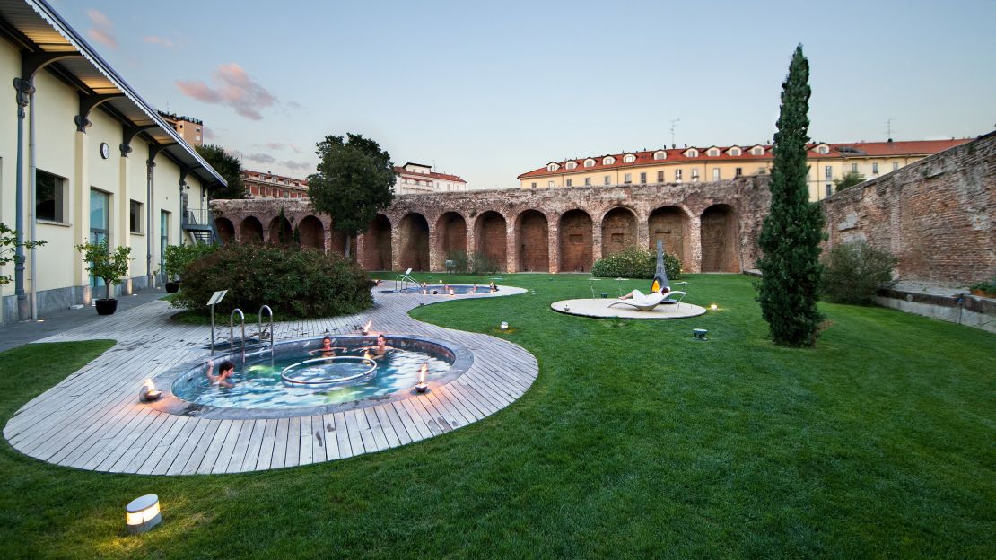 The open-air jacuzzi at Terme Milano is a wellness respite with stunning surroundings.