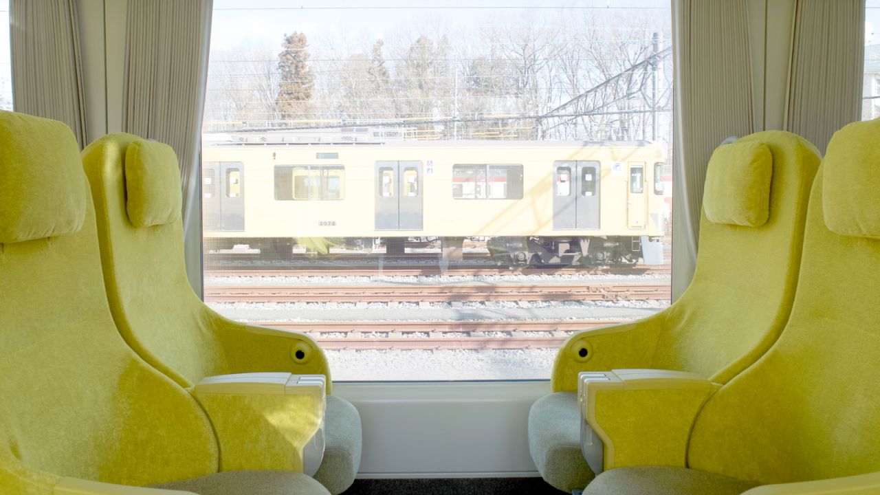 Designed by architect Kazuyo Sejima, the train has soft chairs with an adjustable headrest and armrest table.