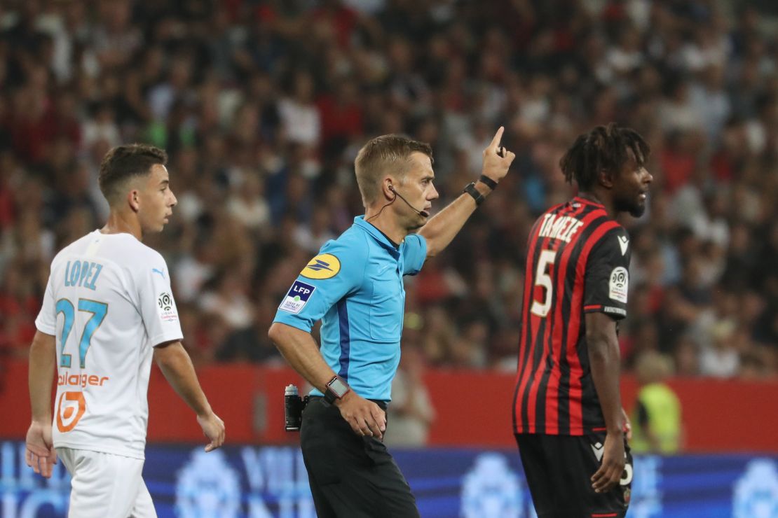 Referee Clement Turpin suspends the game between  Nice and Olympique de Marseille (OM) after persistent homophobic chants and the display of a disparaging banner. 