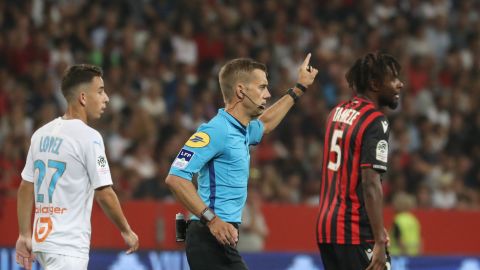 Referee Clement Turpin suspends the game between Nice and Olympique de Marseille after persistent homophobic chants and the display of a disparaging banner.