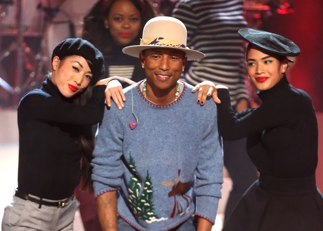 Pharrell Williams (C) performs onstage during "A very Grammy Christmas," at the Shrine Auditorium on November 18, 2014 in Los Angeles, California.  