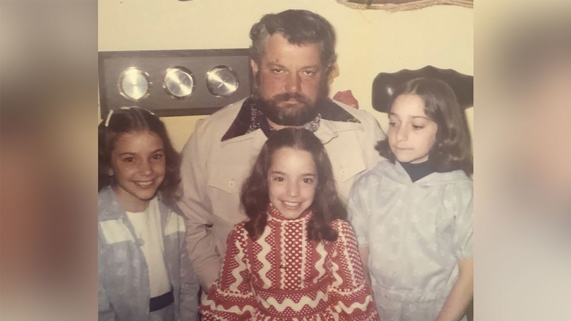 The Heller sisters with their dad.