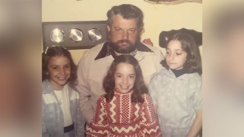 The Heller sisters with their dad.