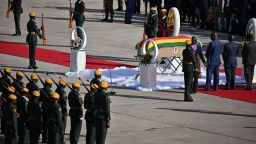 Zimbabwean soldiers perform during a ceremony as the casket of late Zimbabwean President Robert Mugabe arrives at Harare airport on September 11, 2019. - The body of Zimbabwe's ex-president, Robert Mugabe, arrived home on September 11, 2019 for burial in a country divided over the legacy of a former liberation hero whose 37-year rule was marked by repression and economic ruin. (Photo by Tony Karumba / AFP) 