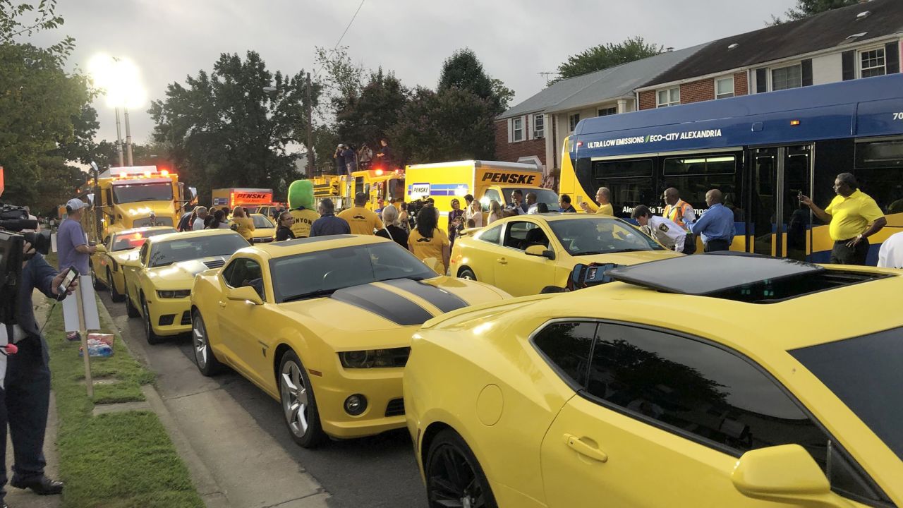 A view of the street with all the yellow vehicles.