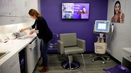 FILE - In this April 24, 2019, file photo dental assistant Jessica Buendia works in SmileDirectClub's SmileShop located inside a CVS store in Downey, Calif. CVS Health reports financial results Wednesday, May 1. (AP Photo/Jae C. Hong, File)