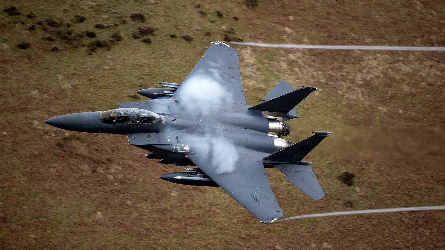  A United States Air Force F-15 fighter jet based at RAF Lakenheath speeds through the Dinas Pass, known in the aviation world as the Mach Loop in Dolgellau, Wales.  