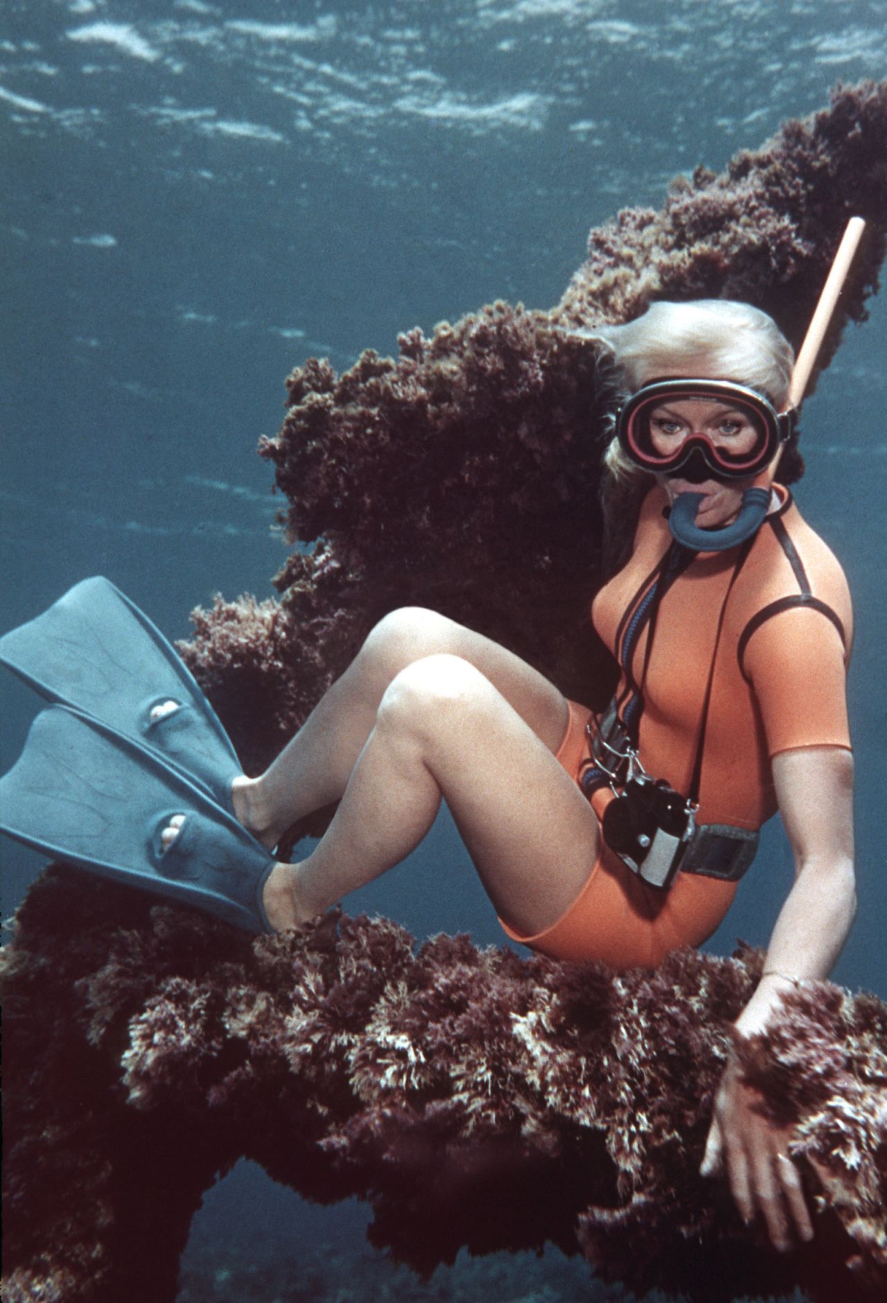 Valerie Taylor on the anchor on the wreck of the Sirius, off Norfolk Island, Australia. The Taylors found the wreck, which was considered lost, in 1963 by swimming outside the reef.