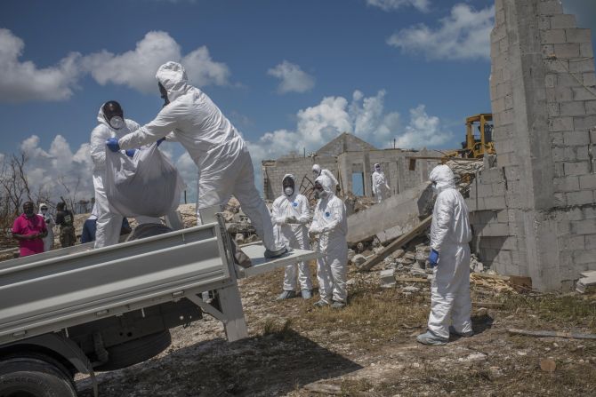 A forensics team removes three bodies that were recovered from a collapsed church in Marsh Harbour, Bahamas, on Saturday, September 7. At least 50 people are dead and hundreds are missing after <a href="http://www.cnn.com/2019/08/28/weather/gallery/hurricane-dorian/index.html" target="_blank">Hurricane Dorian</a> slammed into the islands earlier this month. <a href="https://www.cnn.com/2019/09/12/americas/bahamas-dorian-thousands-missing-thursday/index.html" target="_blank">The death toll is expected to rise</a> as search crews comb through the rubble.