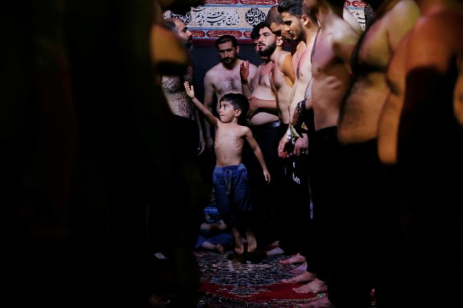 A boy beats his chest while taking part in an Ashura procession in Kerbala, Iraq, on Monday, September 9.