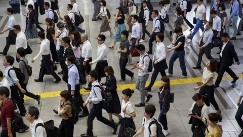 People commute during a morning rush hour at Shinagawa station in Tokyo, July 18, 2019.