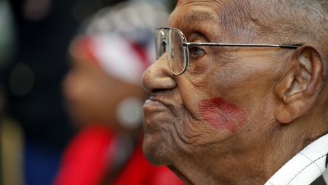 Lawrence Brooks sports a lipstick kiss on his cheek as he celebrated his 110th birthday at the National World War II Museum.