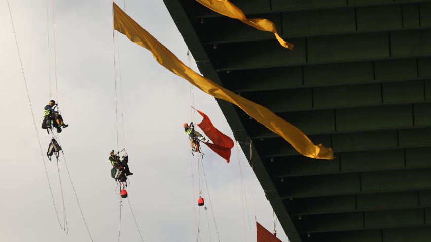 Greenpeace USA climbers form a blockade on the Fred Hartman Bridge in Baytown, Texas shutting down the largest fossil fuel thoroughfare in the United States ahead of the third Democratic primary debate in nearby Houston. The climbers are preventing the transport of all oil and gas through the Houston Ship Channel, home to the largest petrochemical complex in the United States. Their action is a call to the countryÕs present and future leaders to imagine a world beyond fossil fuels and embrace a just transition to renewable energy., 8.19.72.dm.