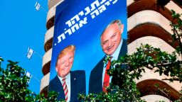 This picture taken on July 28, 2019 shows two giant Israeli Likud Party election banners hanging from a building showing Israeli Prime Minister Benjamin Netanyahu shaking hands with US President Donald Trump, with a caption above reading in Hebrew "Netanyahu, in another league", in the coastal Mediterranean city of Tel Aviv. (Photo by JACK GUEZ / AFP)        (Photo credit should read JACK GUEZ/AFP/Getty Images)