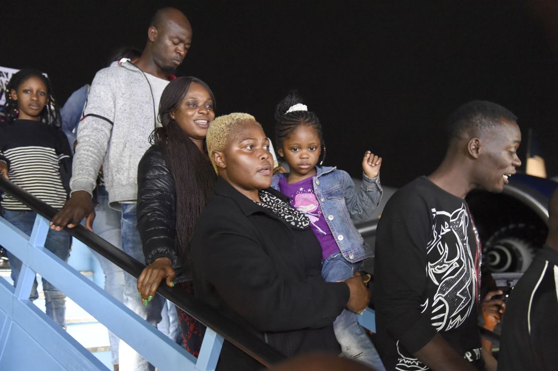 Nigerians return to their home country on a flight from Johannesburg  Wednesday night. 