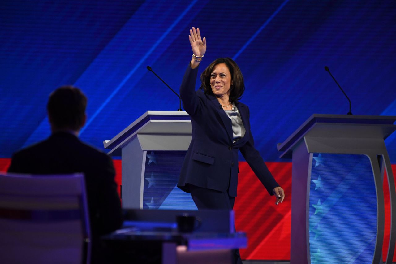 Harris waves as she walks on stage Thursday night.