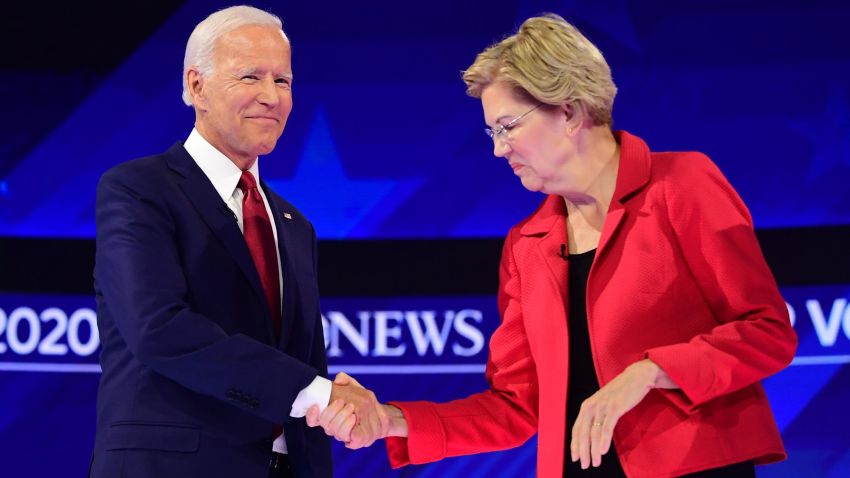 Democratic presidential hopefuls Massachusetts Senator Elizabeth Warren (R) and Former Vice President Joe Biden shake hands as they arrive onstage for the third Democratic primary debate of the 2020 presidential campaign season hosted by ABC News in partnership with Univision at Texas Southern University in Houston, Texas on September 12, 2019.