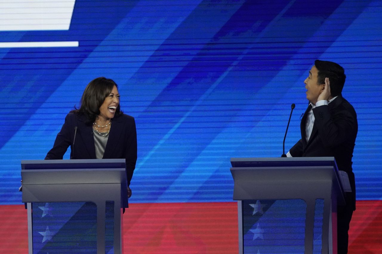Harris laughs with Yang during one of the debate's lighter moments.