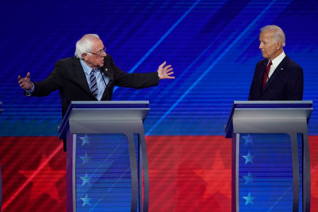 Biden listens as Sanders makes a point. Sanders, a US senator from Vermont, finished second to Hillary Clinton in the 2016 Democratic primaries.