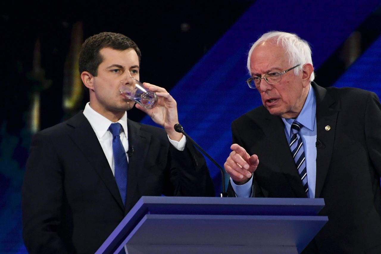 Sanders speaks to Buttigieg during a break in the debate.