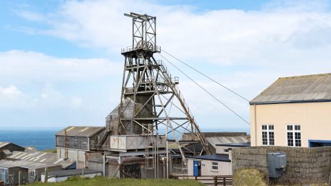 A restored head frame at the old Geevor tin mine in Pendeen, Cornwall,
