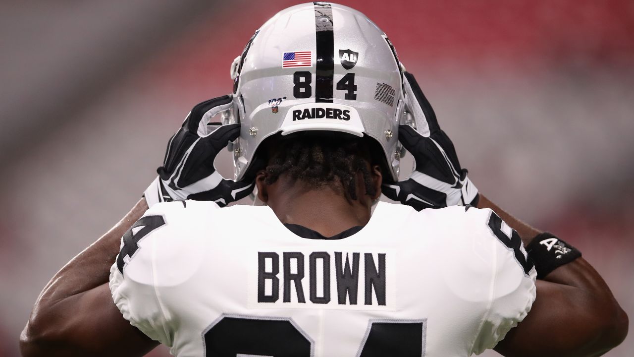 GLENDALE, ARIZONA - AUGUST 15:  Wide receiver Antonio Brown #84 of the Oakland Raiders adjusts his helmet before the NFL preseason game against the Arizona Cardinals at State Farm Stadium on August 15, 2019 in Glendale, Arizona. (Photo by Christian Petersen/Getty Images)