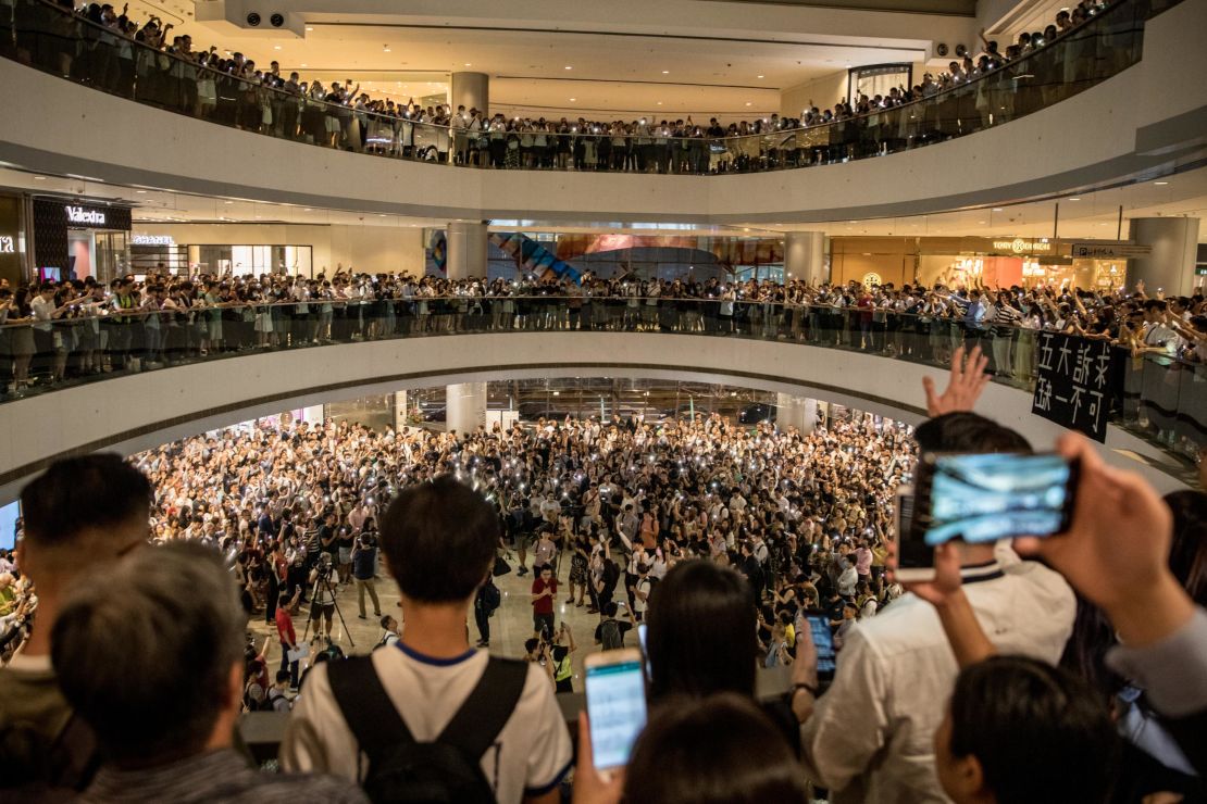 Protesters sing songs and shout slogans after gathering at the IFC Mall on September 12, 2019 in Hong Kong.