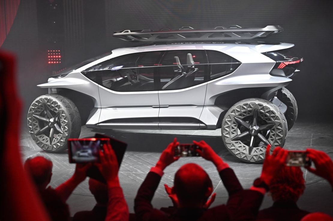 With the Audi AI:Trail concept, designers imagined a future semi-autonomous off-roader. There are no computer screens inside. Enormous windows keep the emphasis on enjoying the outdoors. Instead of headlights, drones fly ahead to light the trail, according to Audi. It is envisioned as largely driving itself on the road but still requiring a human driver when going off-road.