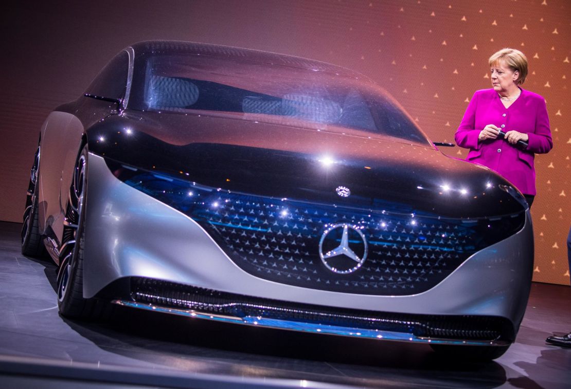 The Mercedes-Benz Vision EQS provides a preview of  an all-electric full-size luxury sedan from the German automaker. The headlights are integrated into a "lightbelt" that goes around the outside of the car. Here, German Chancellor Anglela Merkel tours the exhibit. 