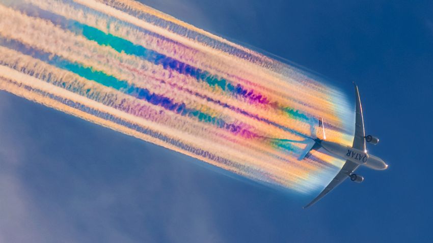 Qatar Airways Boeing 777-2DZ(LR) Reg. A7-BBG as flight QR921 displays some dazzling rainbow contrails as she transits over Brisbane, Australia. Aircraft enroute from Auckland, New Zealand to Doha, Qatar. Height 30,492 ft, Speed 793 km/h, Track 300°.