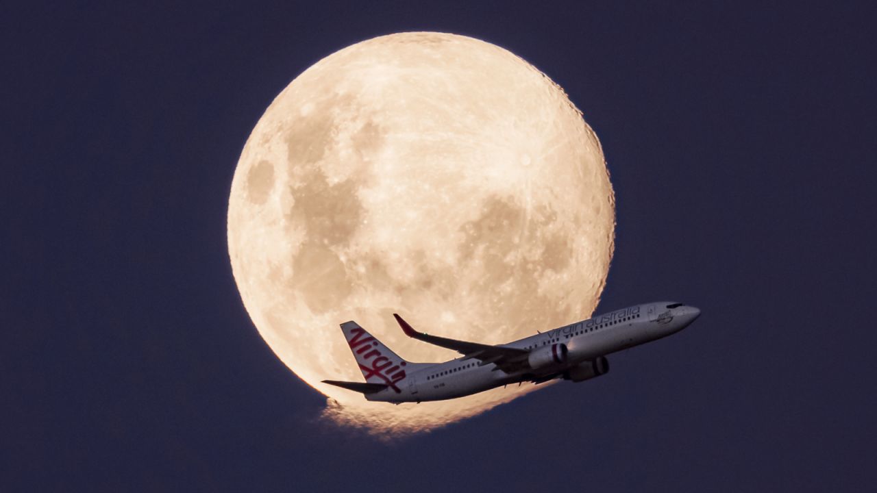 <strong>Moon gazing:</strong> Marston says he's sold a few images to flight crews of their aircraft flying past the moon. Here, a Virgin Australia Boeing 737 crosses the moon.