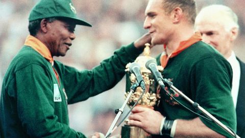 Nelson Mandela hands Francois Pienaar the Webb Ellis Cup after the Springboks beat the New Zealand All Blacks in the 1995 Rugby World Cup