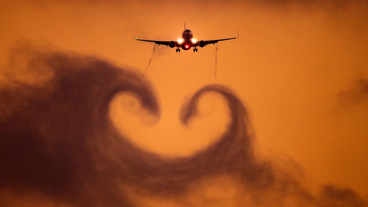 <strong>At sunset:</strong> Clouds and sunset create an intriguing composition in this photograph of a Virgin Australia Boeing 737.