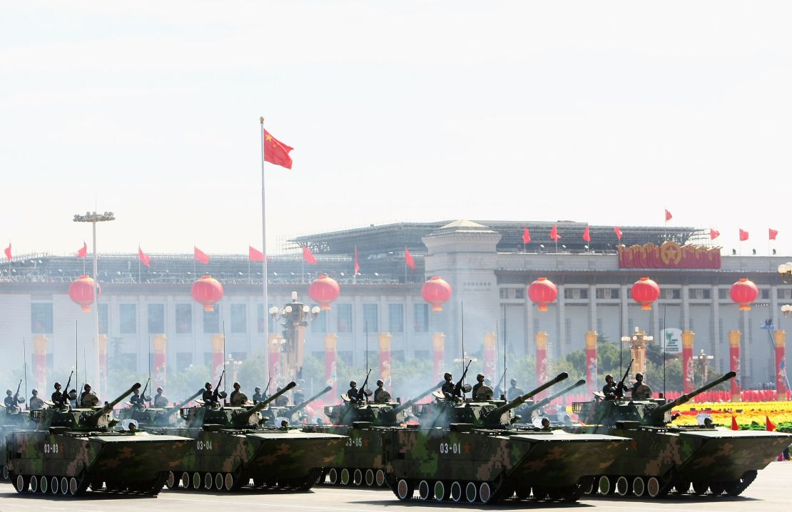Chinese tanks rumble pass Tiananmen Square during a massive parade to celebrate the 60th anniversary of the founding of the People's Republic of China on October 1, 2009 in Beijing.